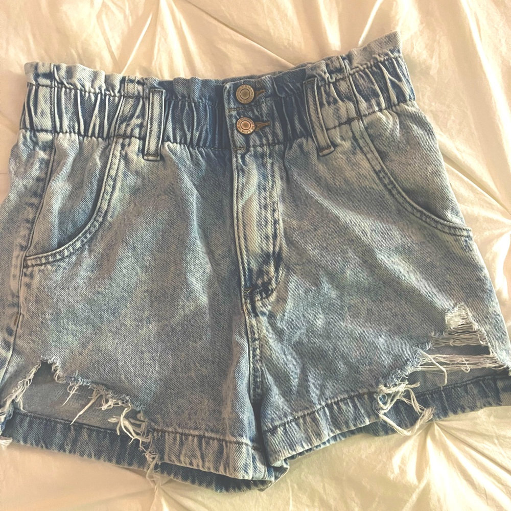 High waisted cinched wait band, semi ripped on front